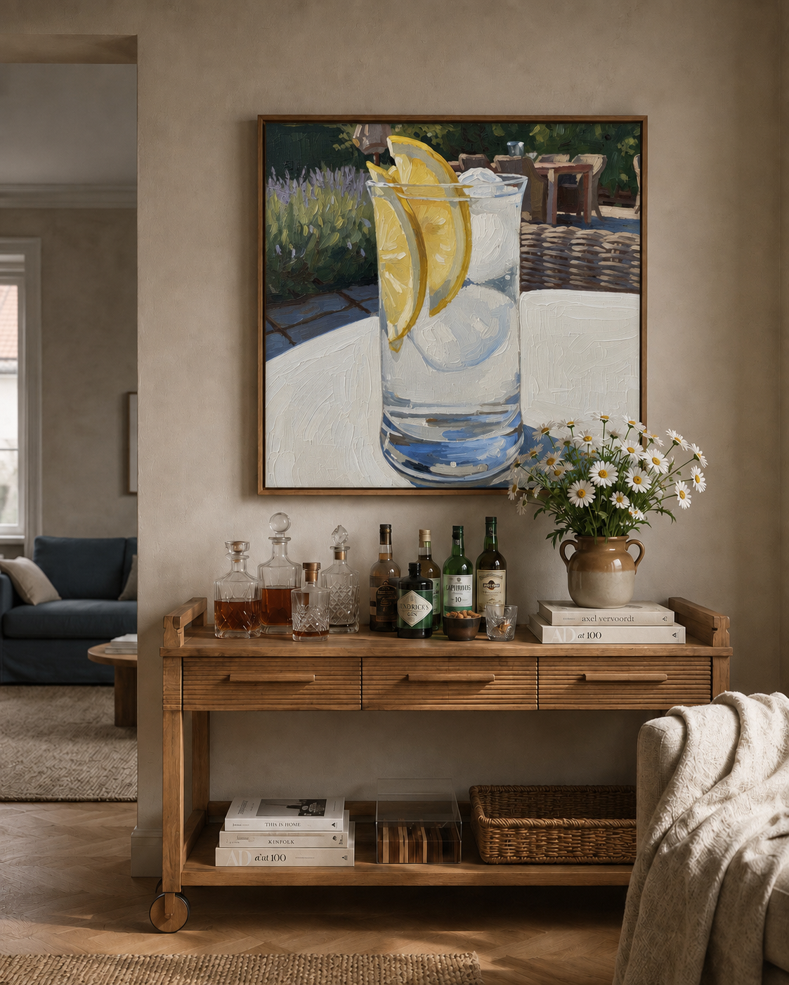 Framed Oil Painting style artwork of a gin and tonic with lemon above an oak bar cabinet