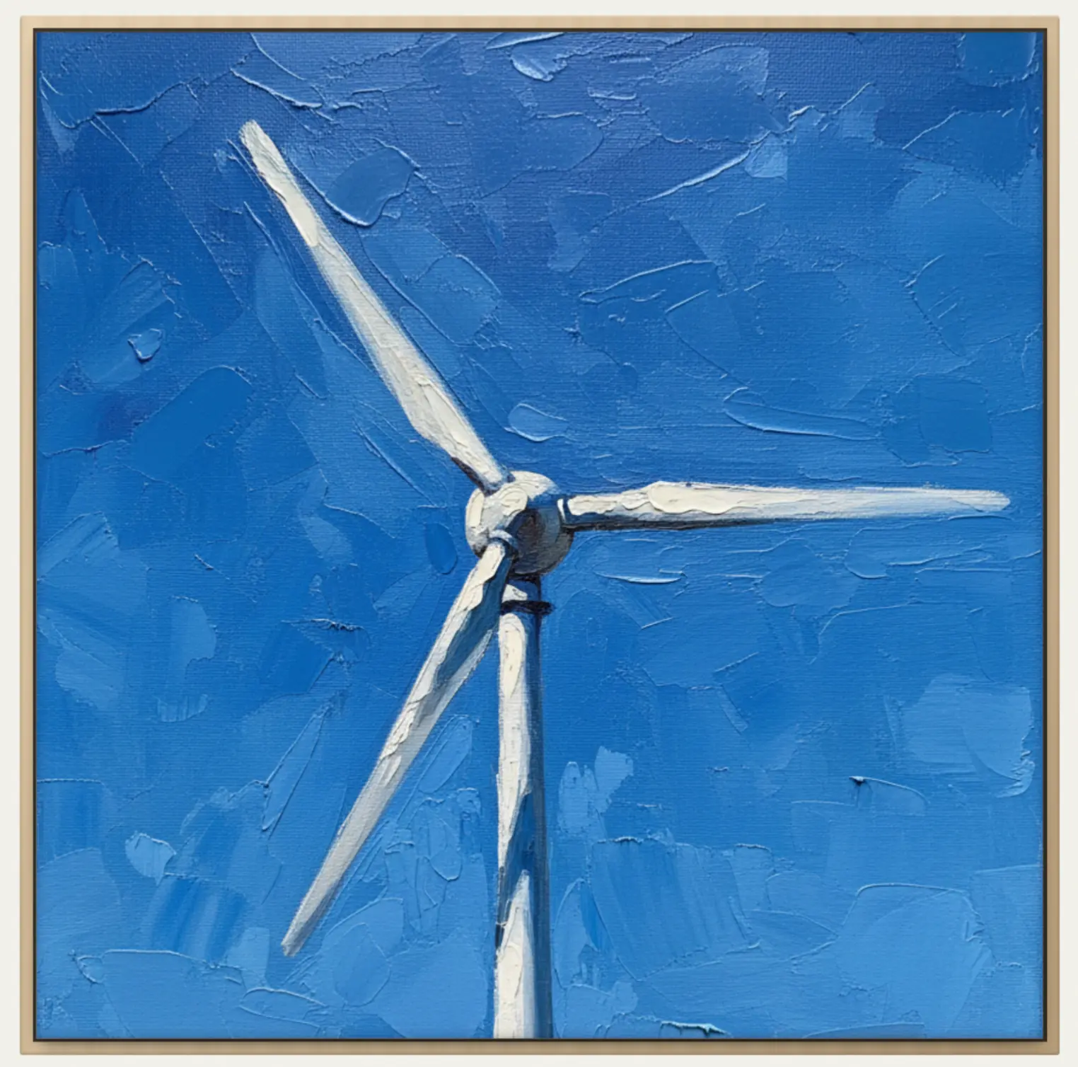 Framed painting of a wind turbine against a deep blue sky